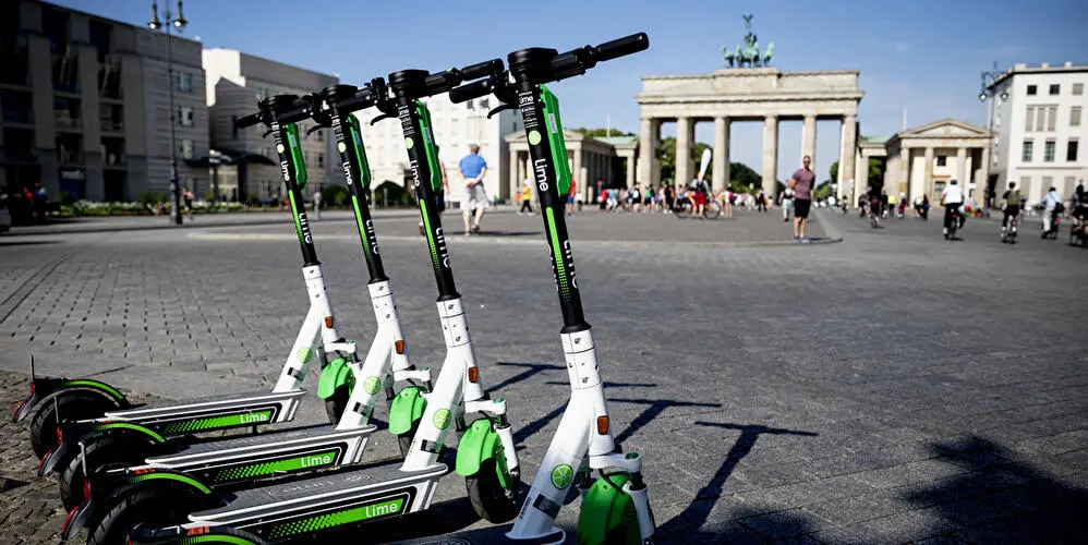 Modern shared electric scooters on a sidewalk